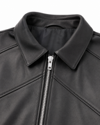 Pointed collar and geometric leather panel detail