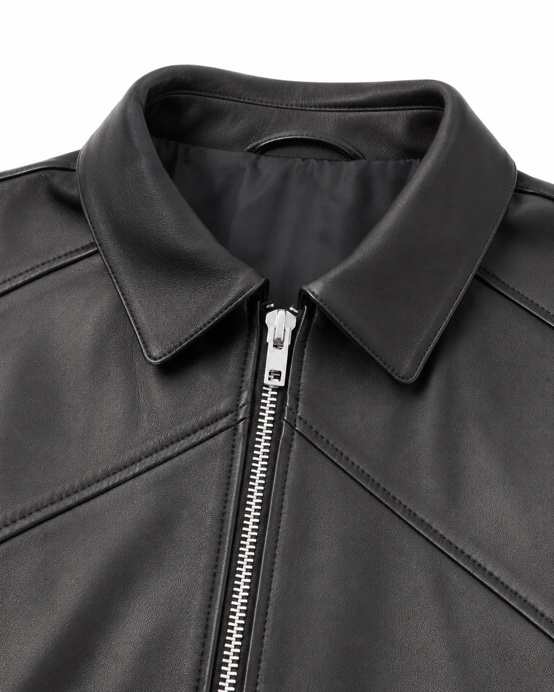 Pointed collar and geometric leather panel detail