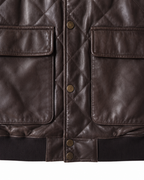 Flap patch pockets and rib-knit hem on leather bomber jacket