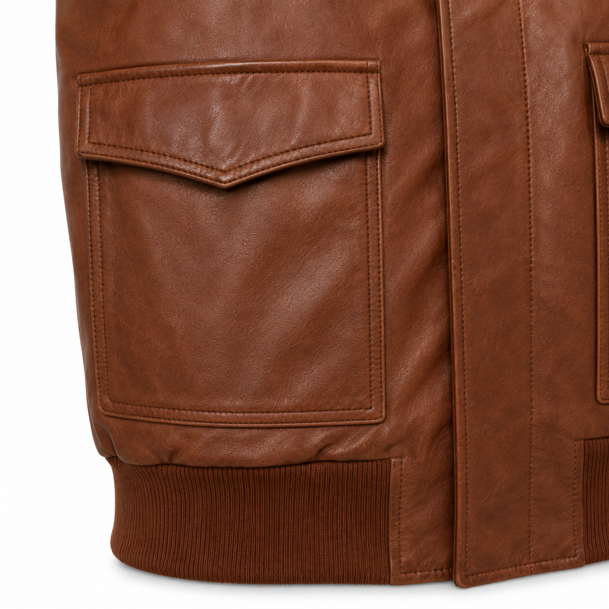 Close-up of a brown leather jacket showing a flap pocket, ribbed knit hem, and clean stitching on a white background.